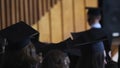 Joyful female graduate walking to stage to receive diploma with honors