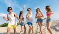 Joyful friends having fun on the beach Royalty Free Stock Photo
