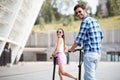 Joyful friends riding a kick board Royalty Free Stock Photo