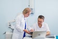 Joyful general practitioners discussing their work at hospital office Royalty Free Stock Photo