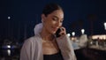 Joyful girl finish call waiting meeting at night city close up. Smiling woman Royalty Free Stock Photo