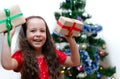 Joyful girl five years old received a gift. Blurry, defocused, selective focus