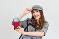 Joyful girl in a hat with airline tickets and luggage Royalty Free Stock Photo