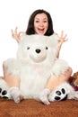 Joyful girl plays with a teddy bear Royalty Free Stock Photo