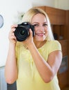 Joyful girl with professional photocamera Royalty Free Stock Photo