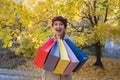 Joyful girl with purchases in hand. Good shopping. Fall discounts Royalty Free Stock Photo