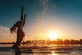 Happy female in red bikini splashing or play in water and have fun at sunset