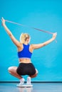 Joyful girl standing on bathroom scales Royalty Free Stock Photo