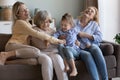 Joyful girls and women of four female generations having fun Royalty Free Stock Photo