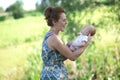 Joyful grandmother is holding on hands her grandson Royalty Free Stock Photo