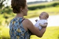 Joyful grandmother is holding on hands her grandson Royalty Free Stock Photo