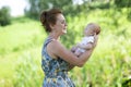 Joyful grandmother is holding on hands her grandson Royalty Free Stock Photo