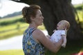 Joyful grandmother is holding on hands her grandson Royalty Free Stock Photo