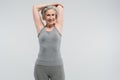 joyful grandmother in sportswear working out