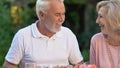 Joyful grandparents having dinner with grandkids, family enjoying time together