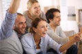 Joyful group of friends watching football game Royalty Free Stock Photo