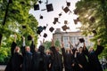 A joyful group of graduates celebrating their accomplishment by tossing their caps high into the air, Group of cheerful student