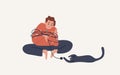 Joyful guy sitting in wrapped Christmas garland playing with cat vector flat illustration. Happy man and pet spend time