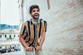 Handsome man riding a scooter, having fun. Selective focus Royalty Free Stock Photo