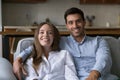 Joyful happy attractive young couple video call shot portrait