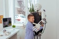 Joyful happy boy hugging a robot