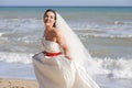 Joyful happy bride on a seacoast