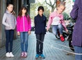 Joyful children play on street of summer city Royalty Free Stock Photo