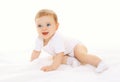 Joyful happy cute baby playing and crawls Royalty Free Stock Photo