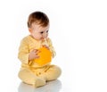 Excited joyful baby kid playing studio portrait