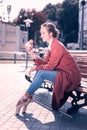 Joyful happy woman eating a delicious hamburger Royalty Free Stock Photo