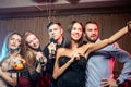 Joyful happy young people have party in karaoke bar Royalty Free Stock Photo