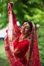joyful indian bride in red sari