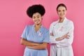 joyful interracial oncologists with ribbons crossing Royalty Free Stock Photo