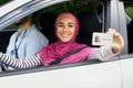 Joyful Islamic Lady In Hijab Demonstrating Driver Licence At Camera Royalty Free Stock Photo