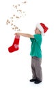 Joyful kid releasing stars from Christmas stocking