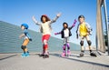 Joyful kids rollerblading outdoors at sunny day Royalty Free Stock Photo