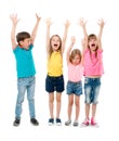 Joyful laughing children with hands up