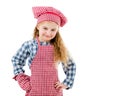 Joyful little girl in red apron isolated on white background Royalty Free Stock Photo