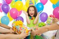 Joyful little kid girl receiving gifts at birthday Royalty Free Stock Photo