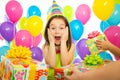 Joyful little kid girl receiving gifts at birthday Royalty Free Stock Photo