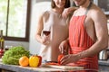 Joyful loving couple preparing healthy food