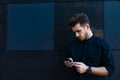 Joyful male having cellphone conversation during rest outdoors Royalty Free Stock Photo