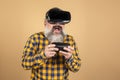 Joyful man in 3d glasses plays a console, virtual reality Royalty Free Stock Photo