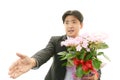 Joyful man holding flower bouquet Royalty Free Stock Photo