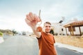 Joyful man shows keys on the background of new home Royalty Free Stock Photo