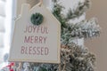 joyful merry and blessed christmas decorations on Christmas tree