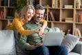 Joyful Middle Aged Spouses With Laptop Having Fun And Relaxing At Home Royalty Free Stock Photo