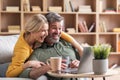 Joyful Middle Aged Spouses Watching Funny Videos Online On Laptop At Home Royalty Free Stock Photo