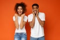 Joyful millennial african american couple rejoice success