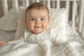 Joyful Monthold Baby Girl In A Crib Wearing White Clothes, Captured Lovingly